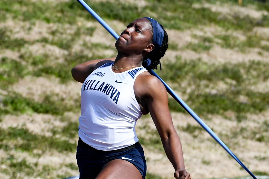 Woman in an extreme throwing posture with an Olympic-grade javelin
