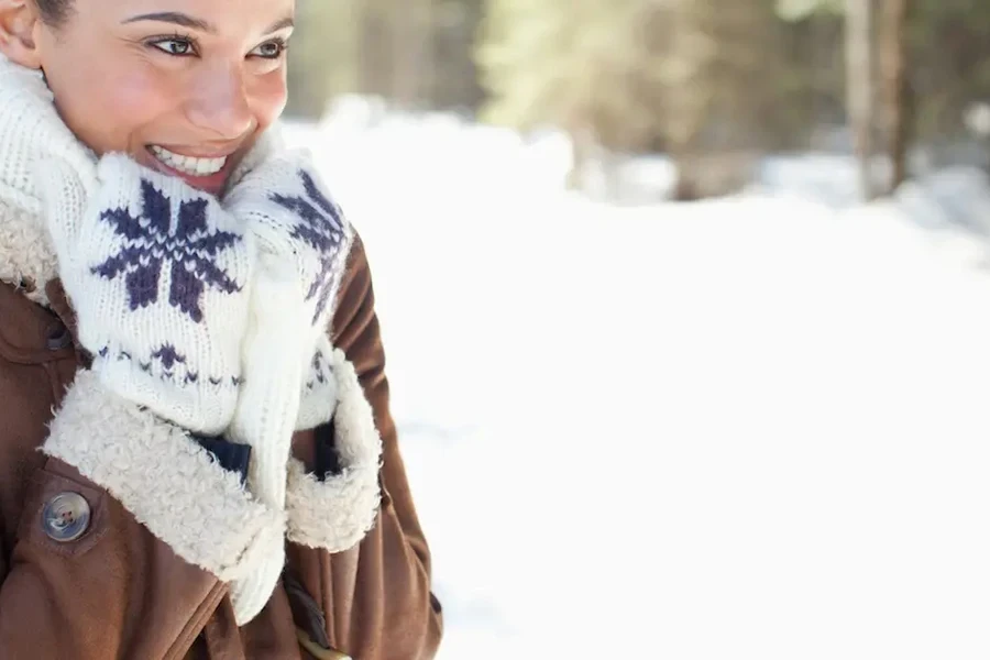 Woman outdoors enjoying the heat from hand warmers