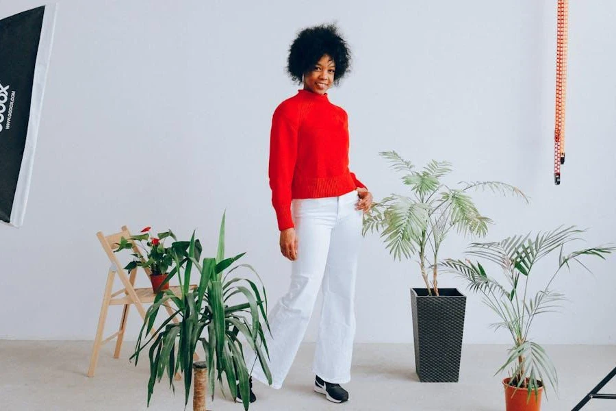 Woman shooting a photo in a casual Christmas outfit