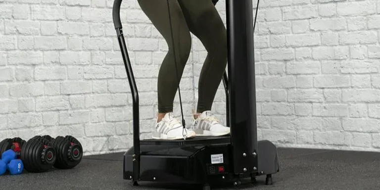 Woman using a full-sized vibration plate machine