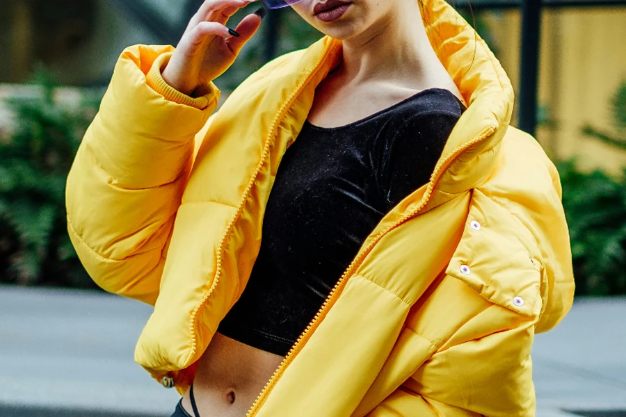 Woman wearing yellow puffer jacket