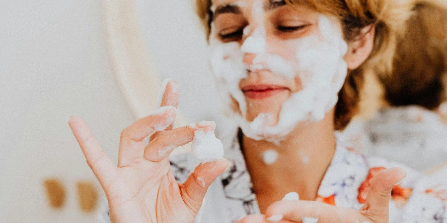 Woman with a Bubble Face Mask Standing in a Bathroom