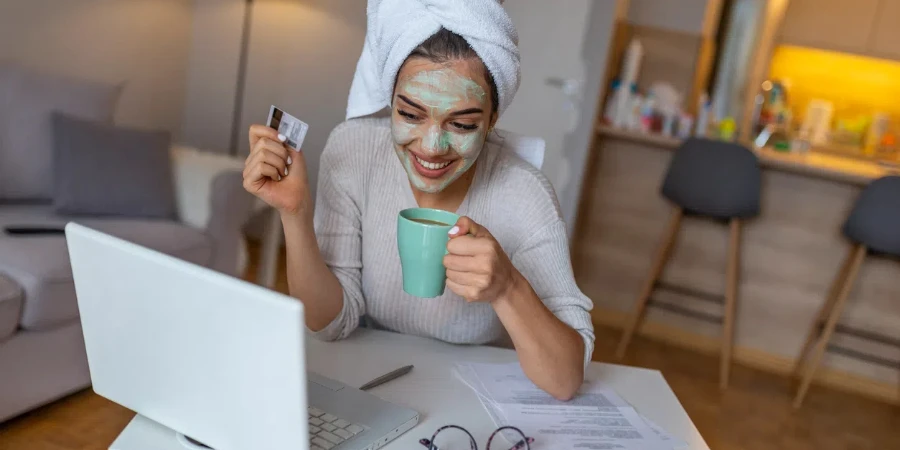 Woman with cosmetic face mask shopping online
