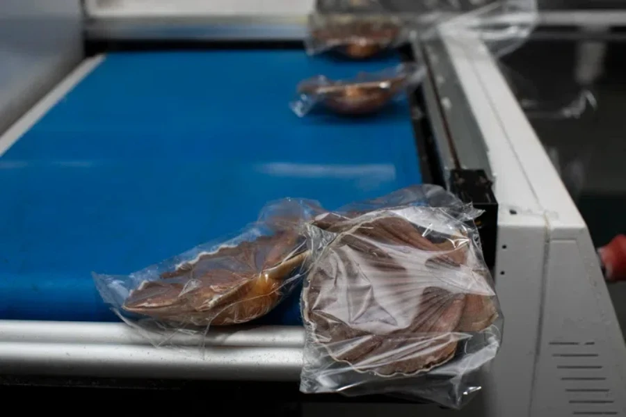 Worker packing seafood at a food processing plant