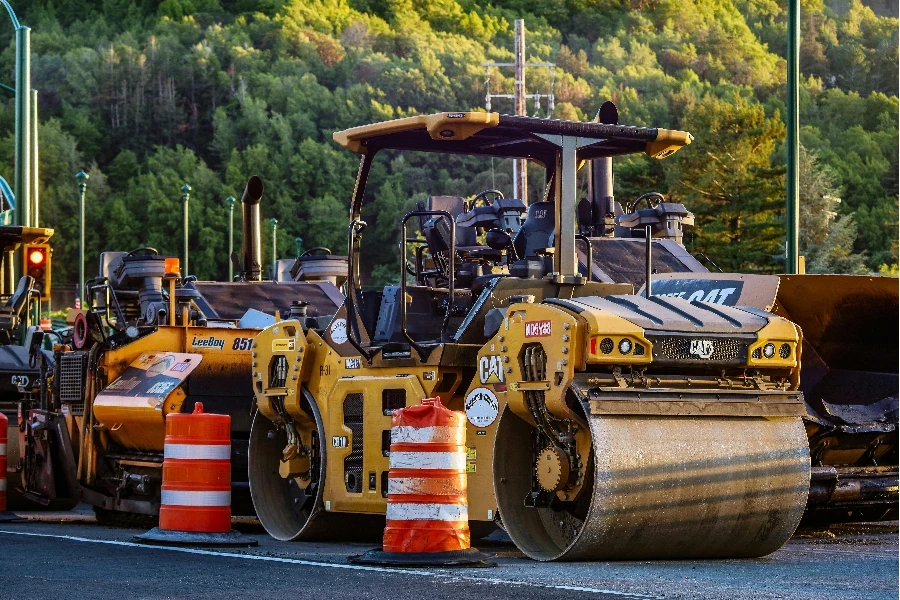 Yellow Road Roller Parked on Side of the Road