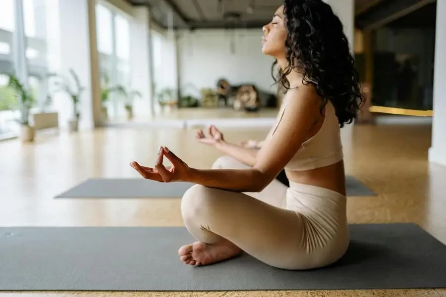 Young Woman Practising Yoga by Yan Krukau