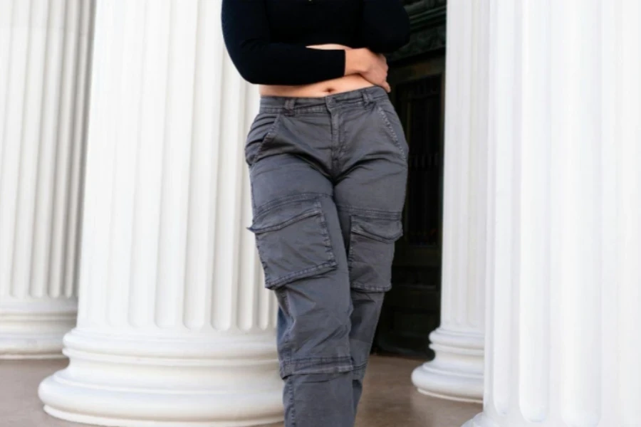 Young Woman in a Casual, Trendy Outfit Posing by the Alameda High School Building