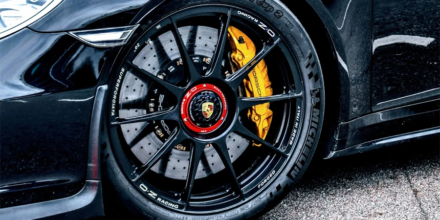 a close up of a black sports car tire