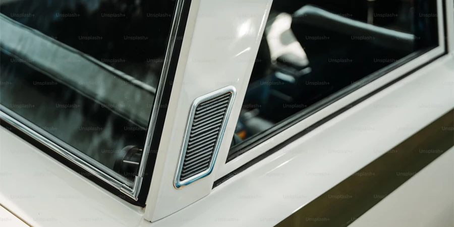 a close up of a white car with a window