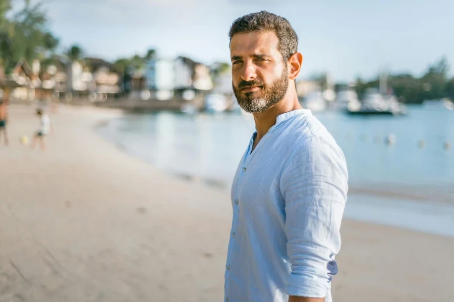 a man wearing a linen shirt as one of the festival outfits for men