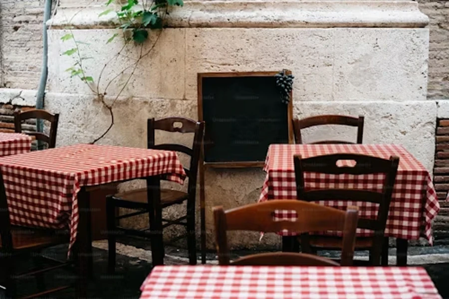 a restaurant with red and white checkerd tables and chairs