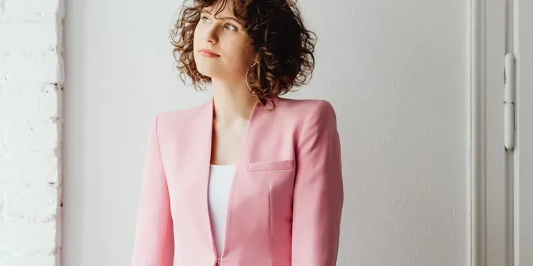 A stylish woman wearing a pink and white outfit