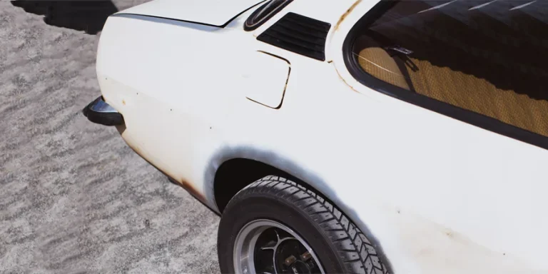 a white car parked on the side of the road