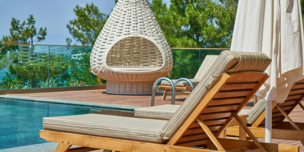 aesthetic poolside environment with sun loungers on deck