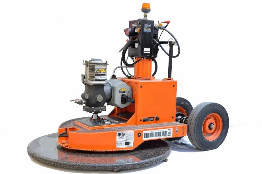 The orange and black floor sander