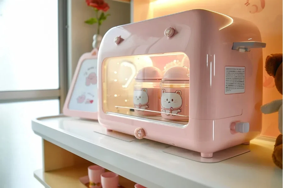 a pink bottle sterilizer and dryer is on the table