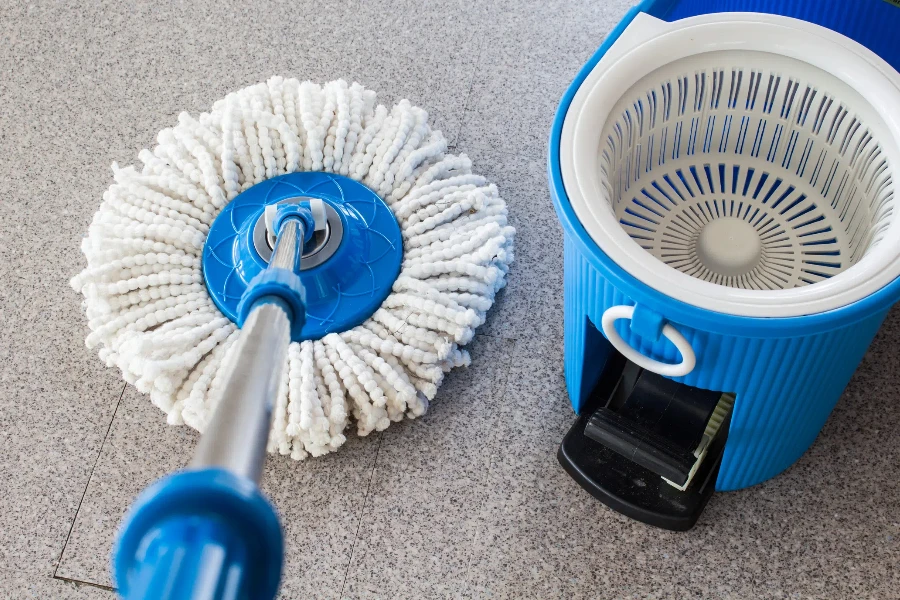 Blue foot-activated pedal spin mop