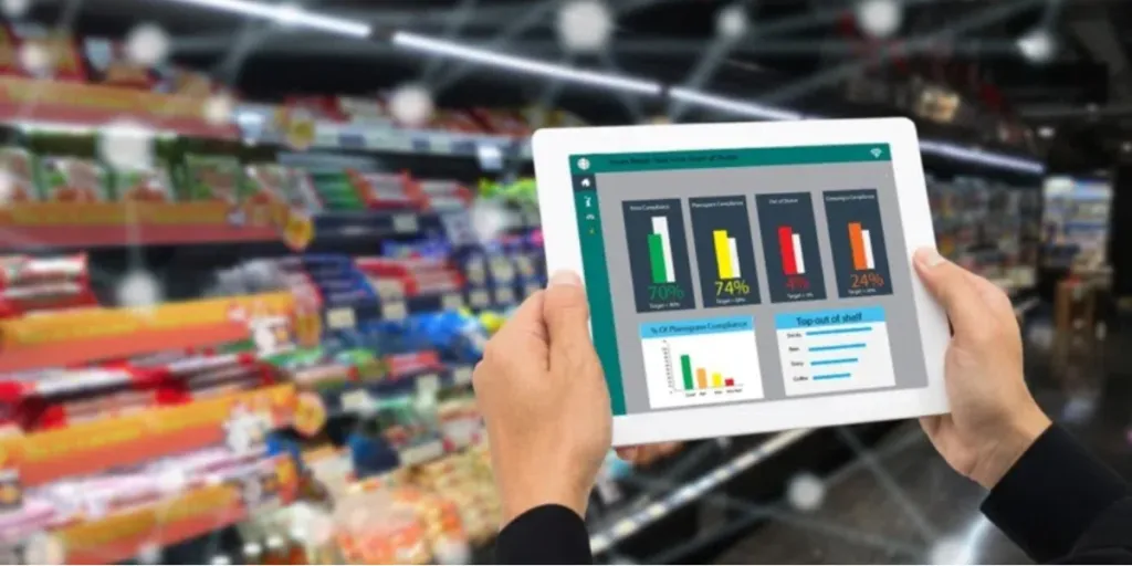 Business owner checking retail analytics on a tablet