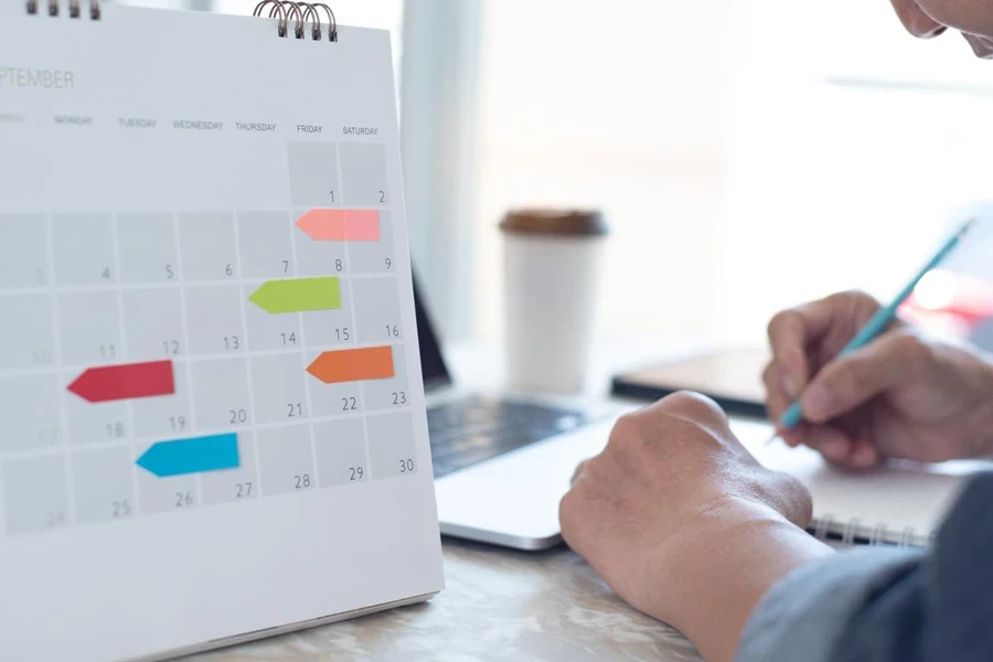 businessman planning work schedule at office with laptop computer on desk.