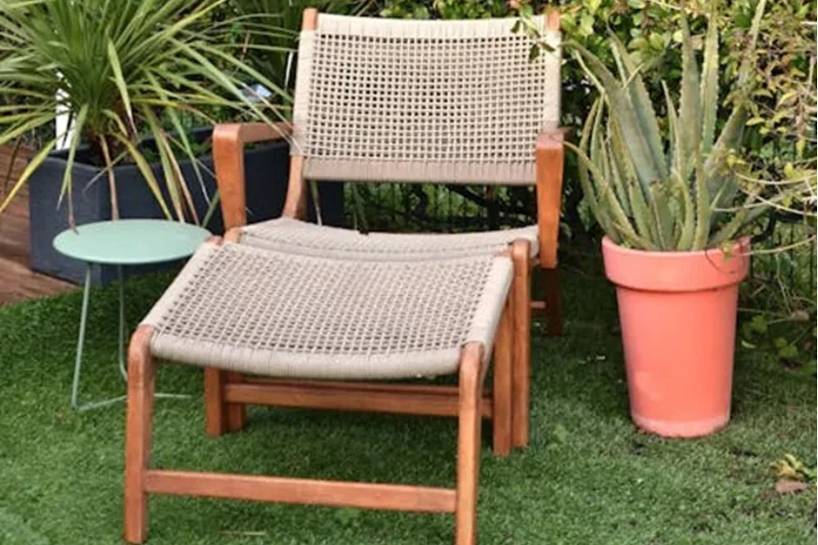 Comfortable natural wood and rattan lounge or sun chair