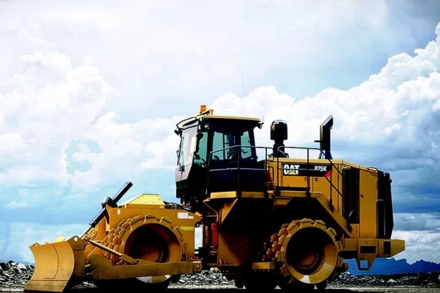 a compact track loader is on the road