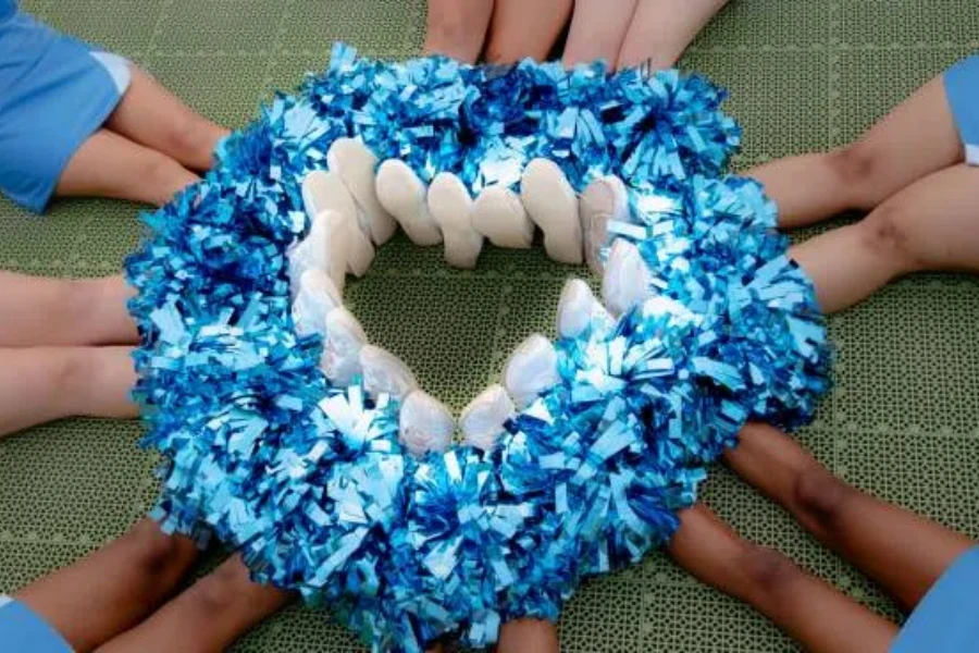 Heart made of shoes with pom-poms in the middle