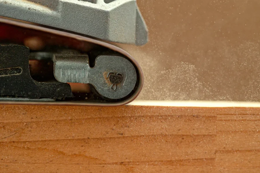 industrial sanding machine smooths out at wooden board