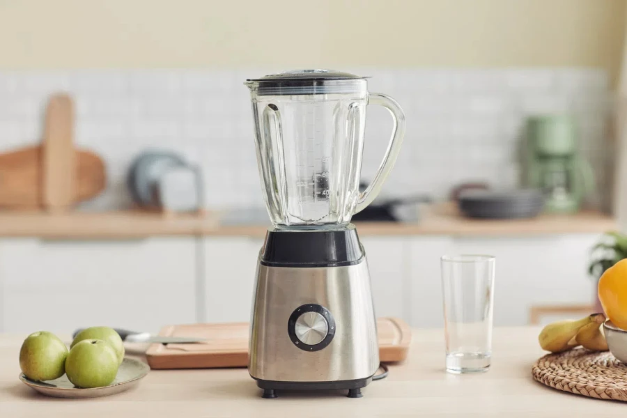 blender on kitchen counter with fruits