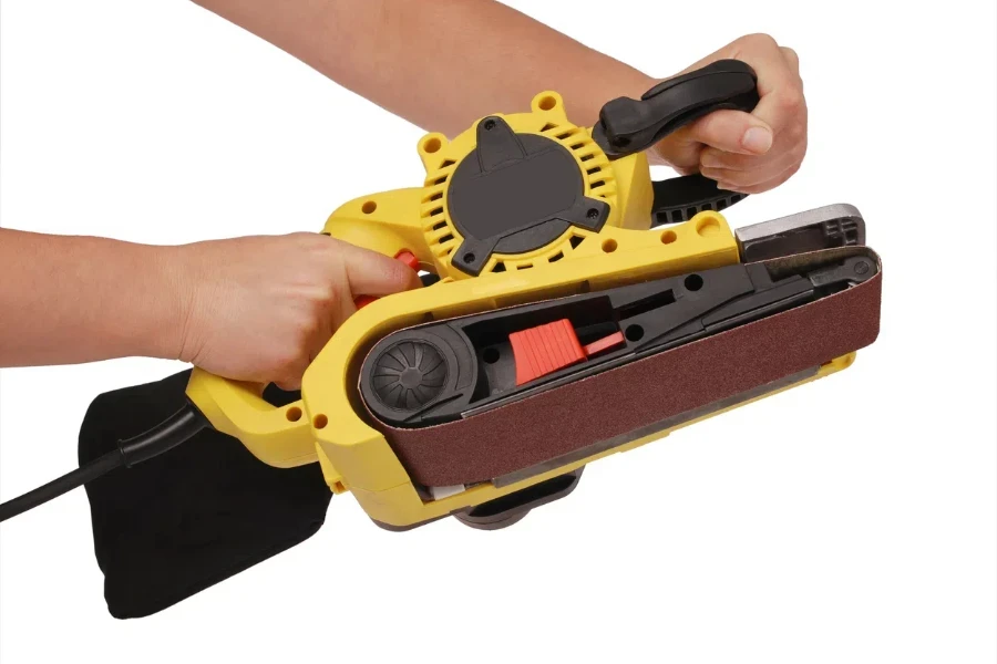 hand holds new professional finishing sander