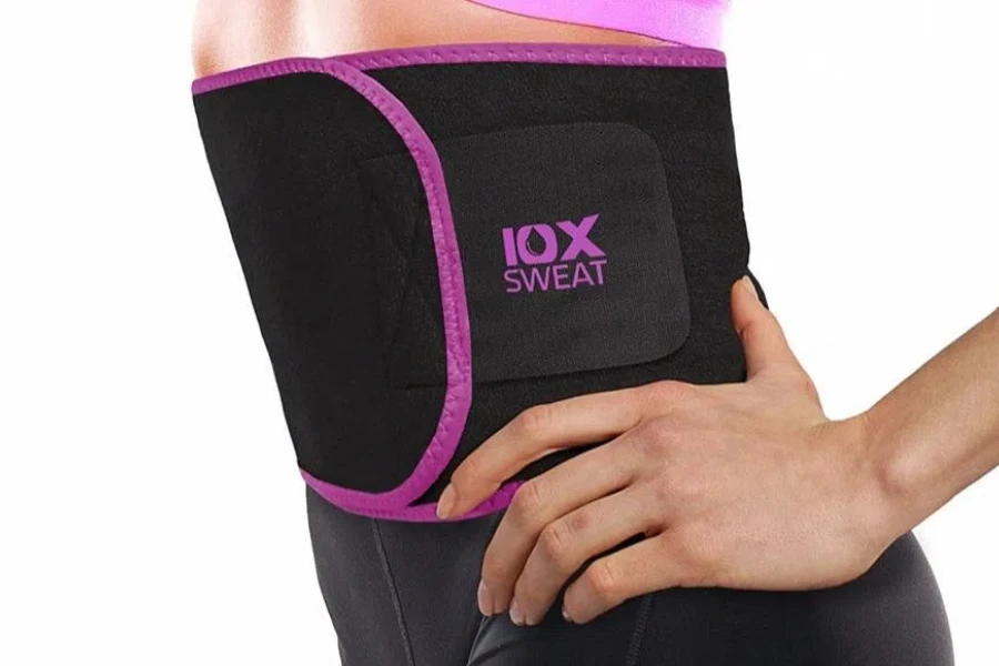 Lady in a black waist trimmer with pink highlights