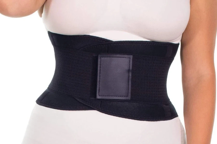 Lady posing in a black waist trimmer