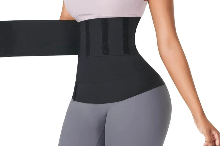 Lady wearing a wrap-style waist trimmer