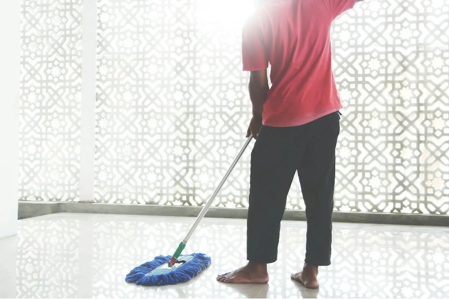 Man mopping with rectangular chenille mop