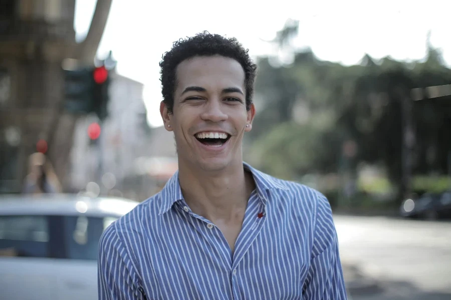 man wearing a light blue striped shirt