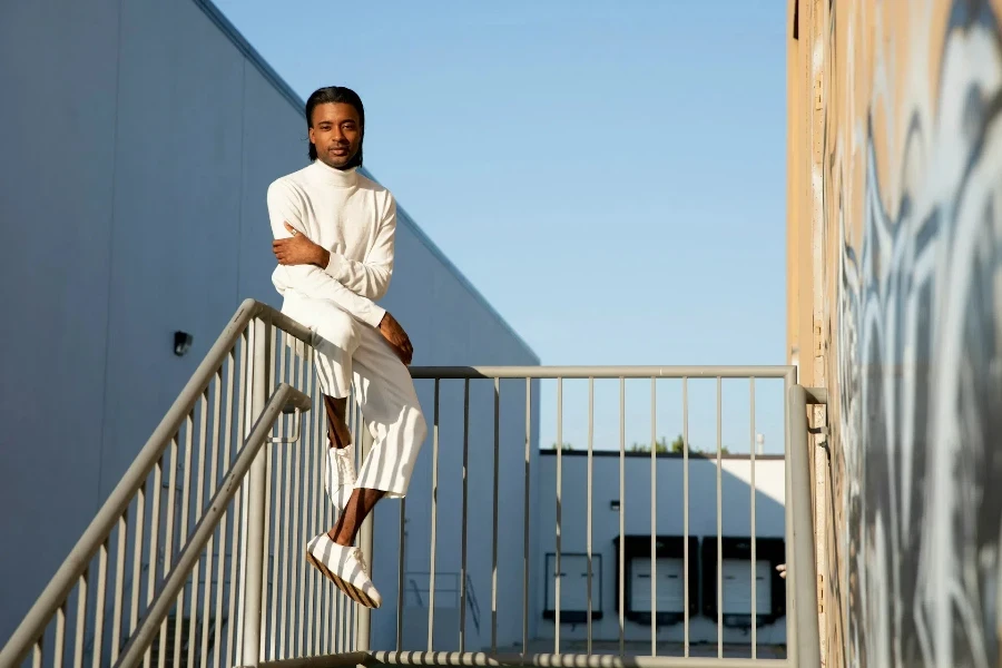 man wearing an outfit featuring neutral colors