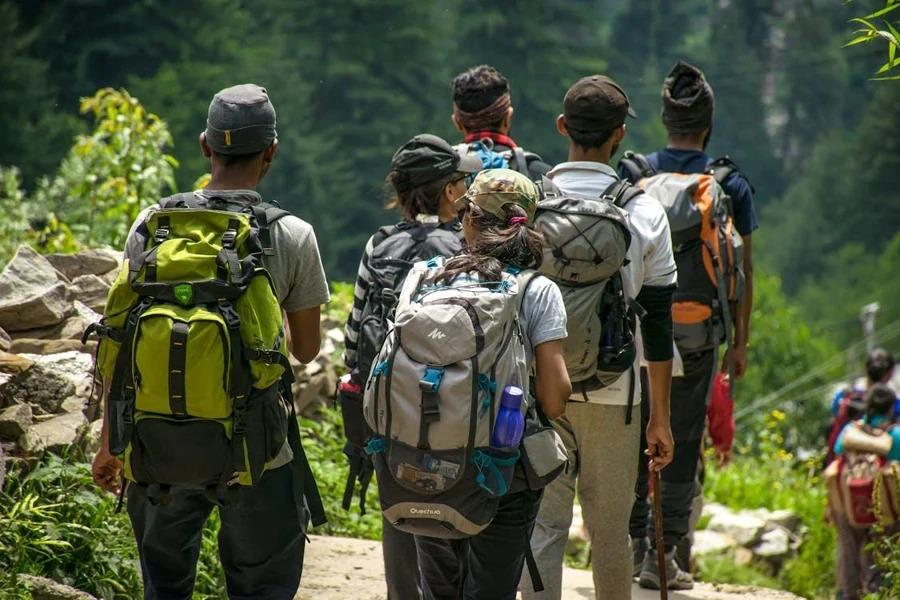 people hiking and wearing baseball caps