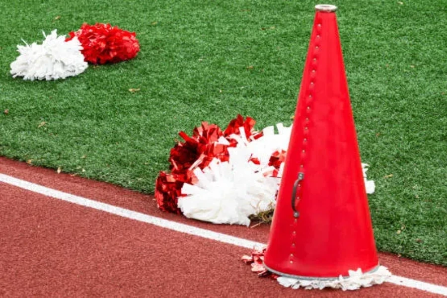 Red and white pom-poms with red horn