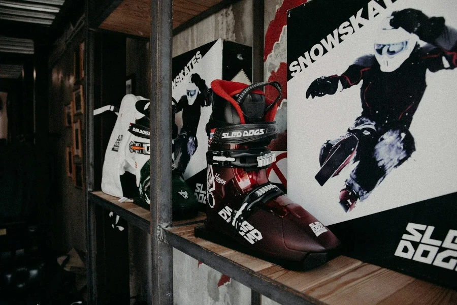 Ski boots lined up on shelf in store