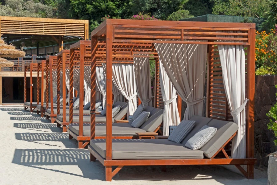 sun-shaded double chaise lounge at a tropical seaside