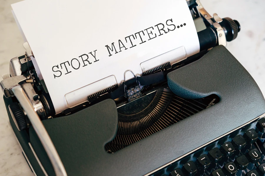 typewriter with a paper written “STORY MATTERS”