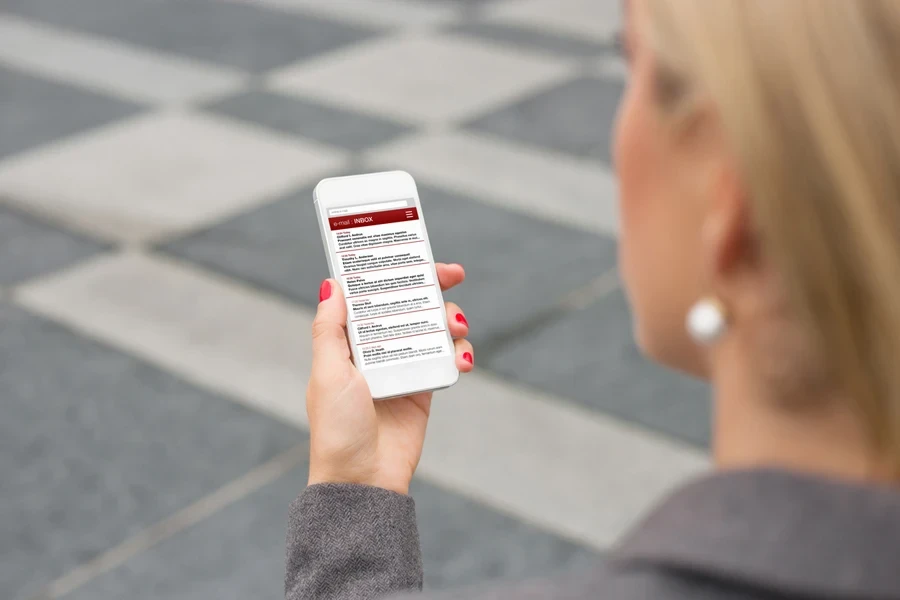 woman checking emails on her smartphone