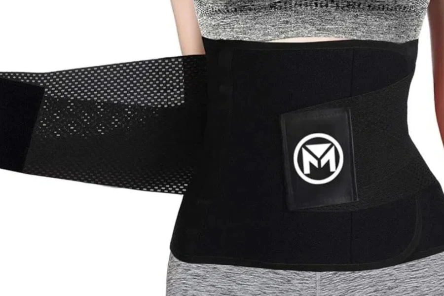 Woman holding a waist trimmer with a logo