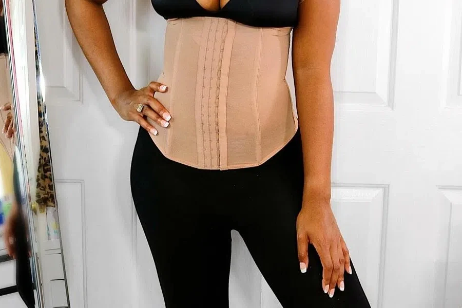 Woman in a cream waist trainer corset