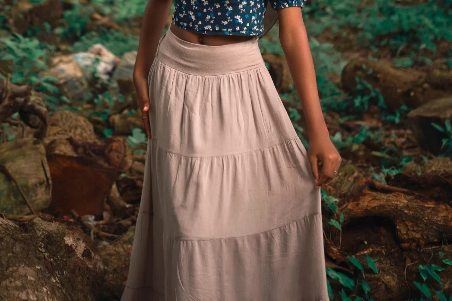 Woman in beige tiered long skirt