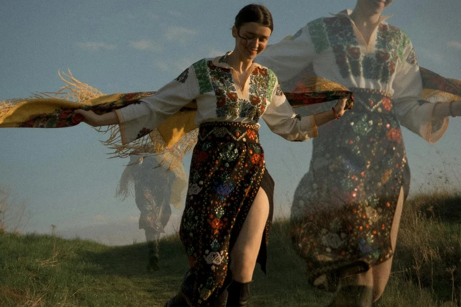 Woman in embroidered boho top and skirt