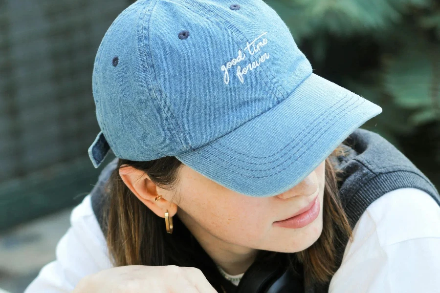 Woman wearing a blue baseball cap
