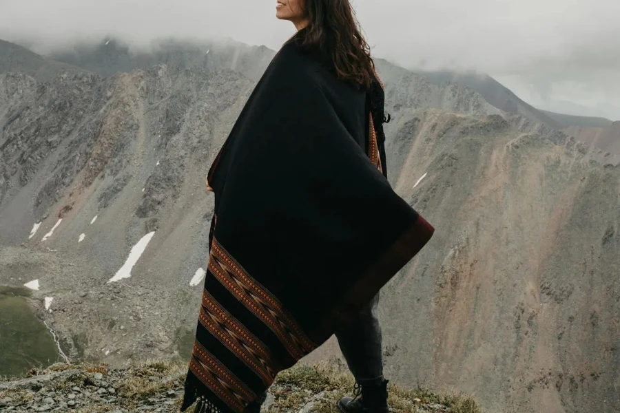 Woman wearing wool blanket cape