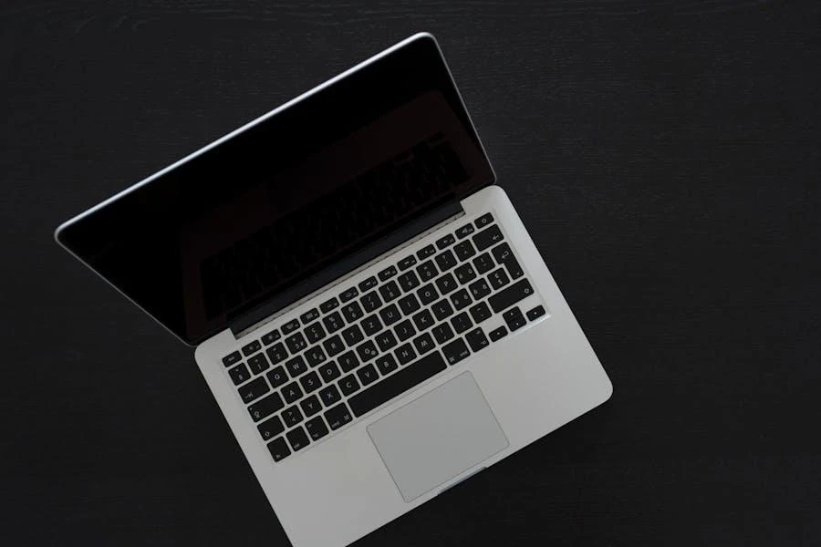 A MacBook Pro on a gray surface