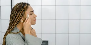 A Side View of a Woman Doing Her Skin Care