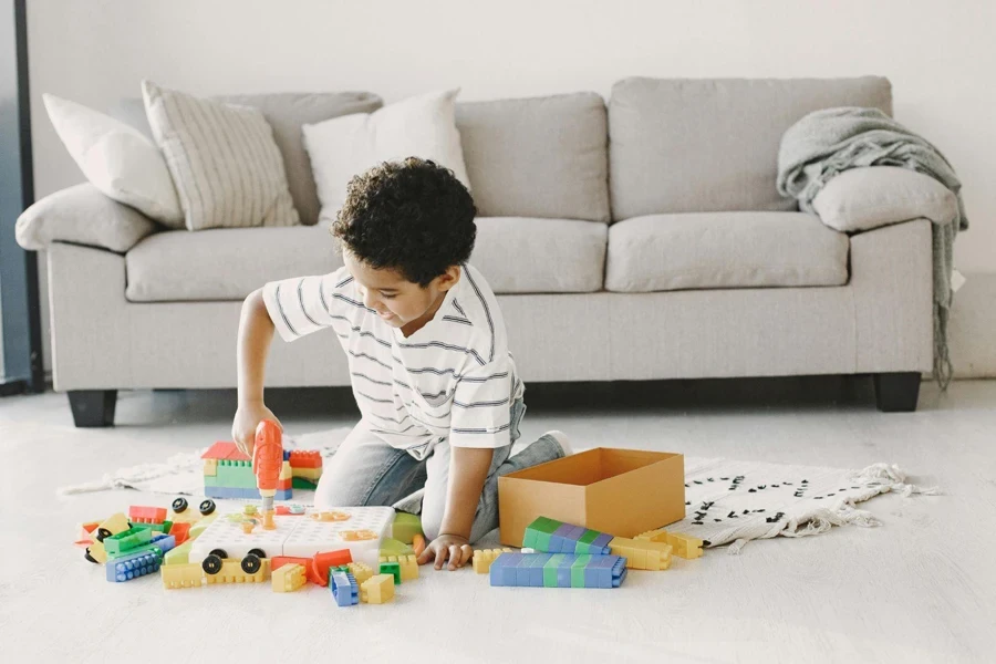 A Young Boy Enjoying Playing Toys